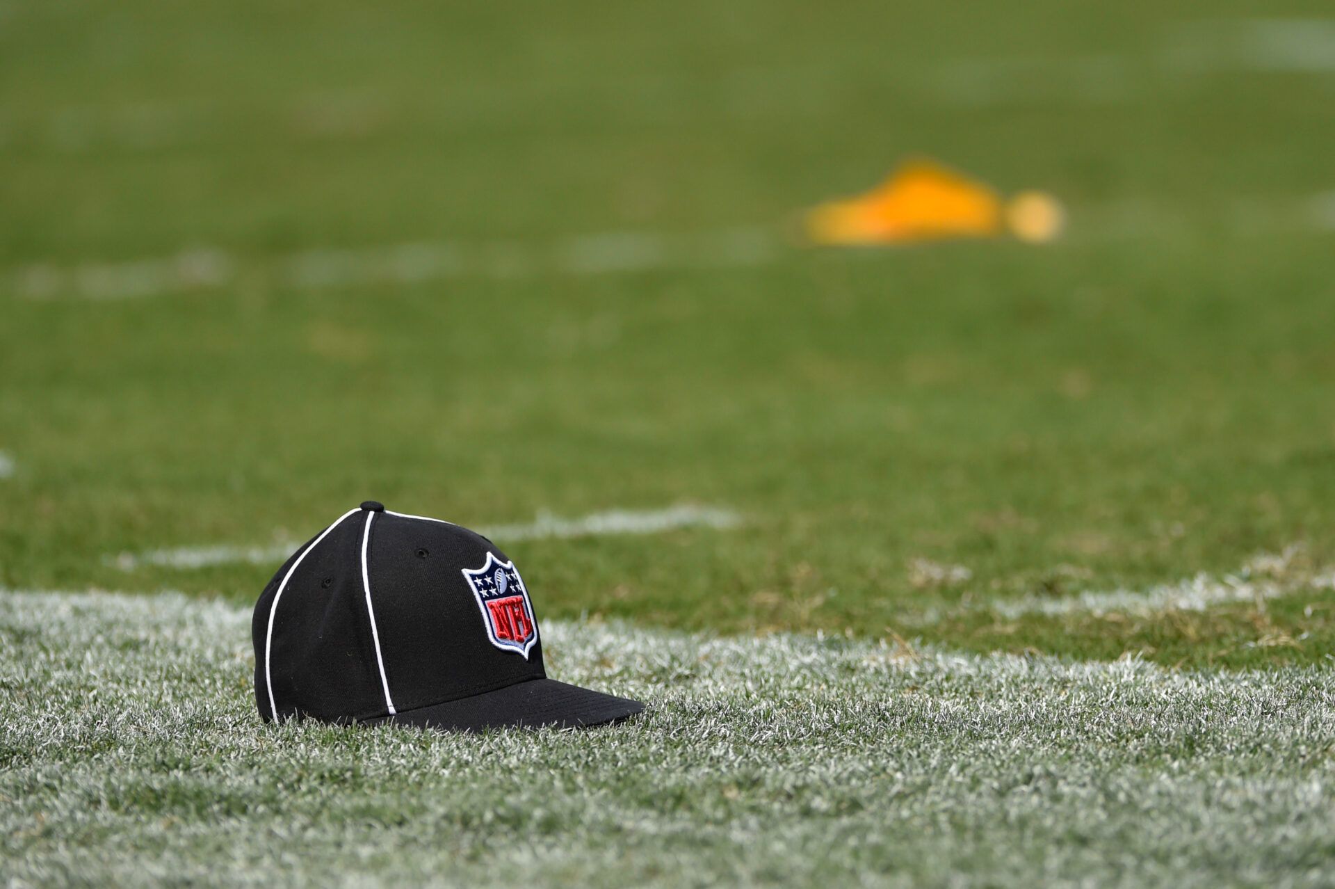 Why do NFL refs wear that hat? Heres the story behind the iconic nfl ref hat.